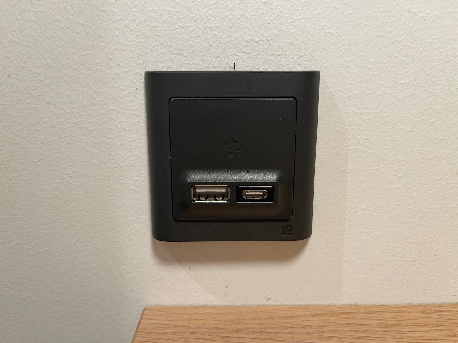 a black usb ports on a white wall