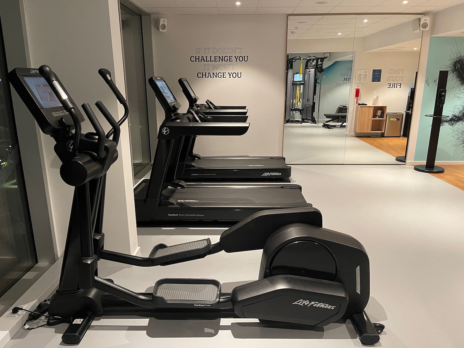 a group of treadmills in a gym