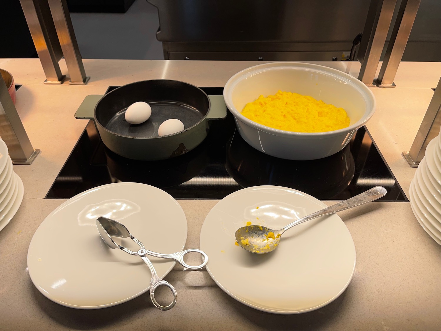 a plate with eggs and a bowl of food on it