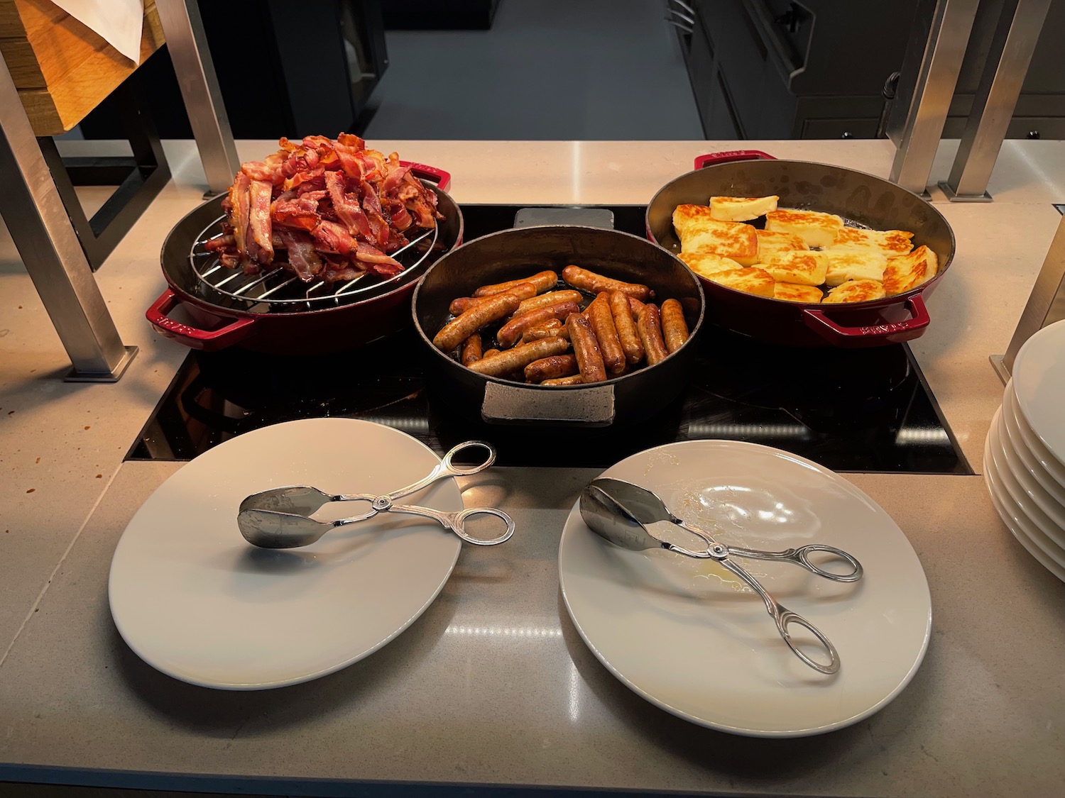 a group of pans with food on a counter