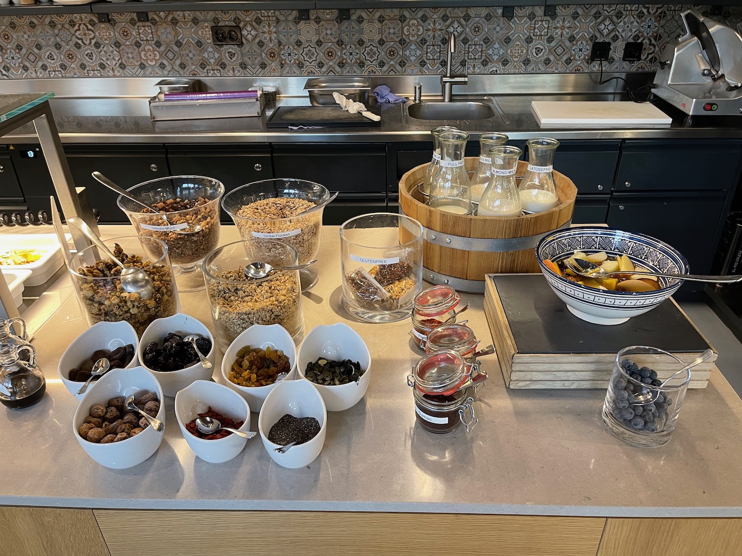 a table with bowls of food and other items on it