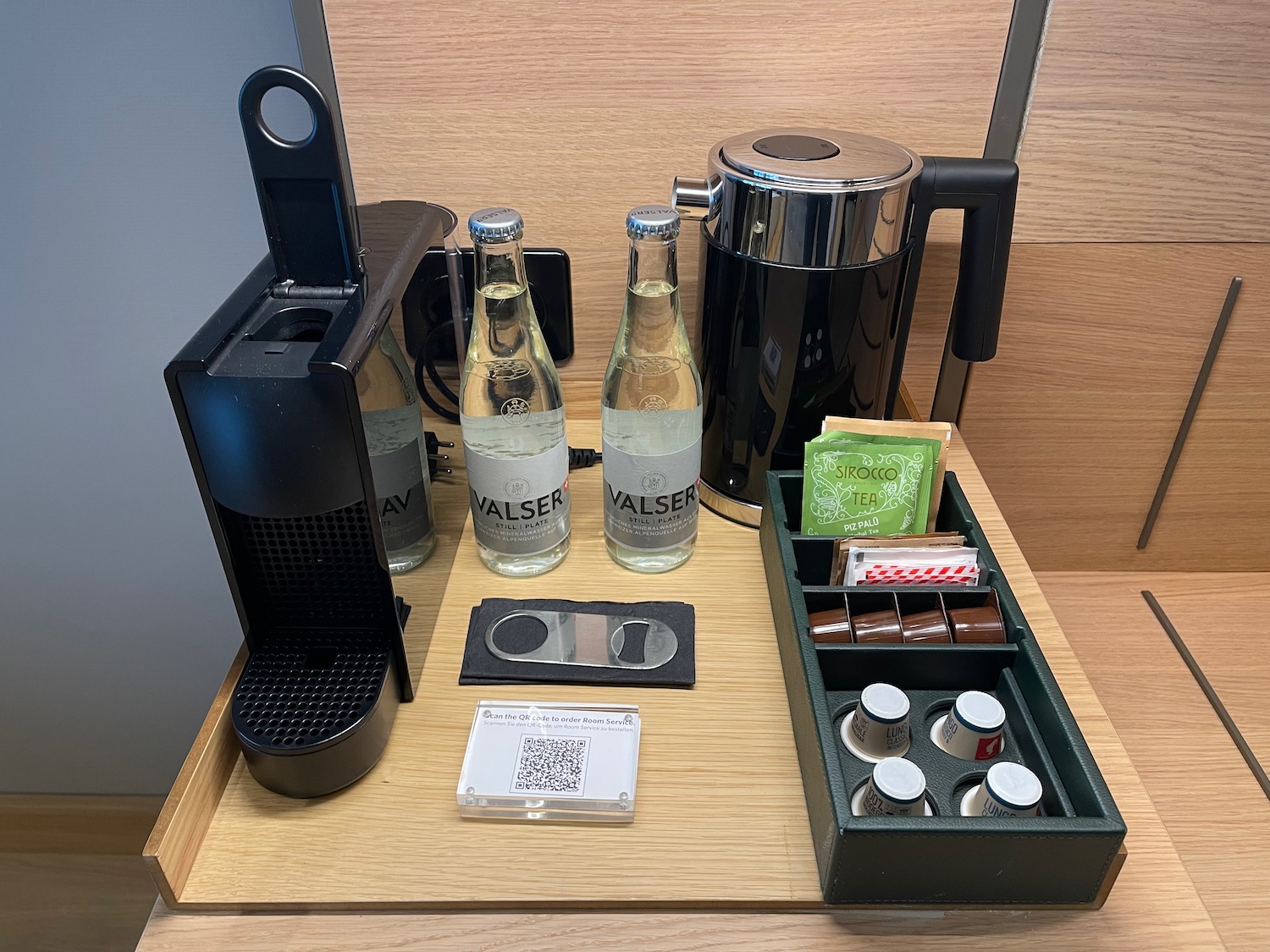 a coffee machine and bottles on a table