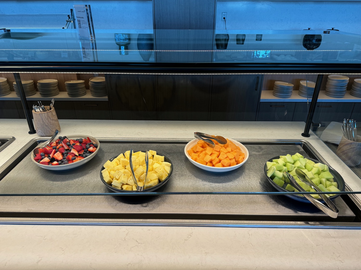 a buffet with fruit in bowls