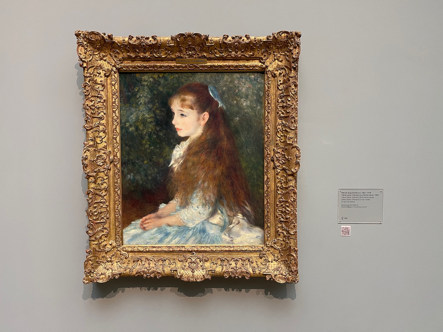 a painting of a girl in a gold frame