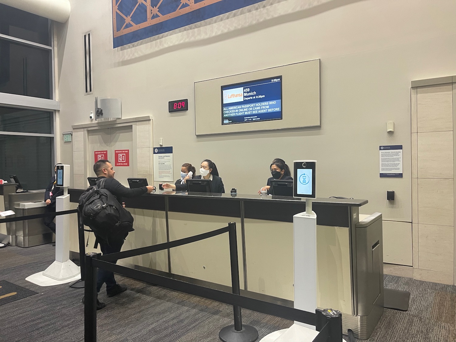 people at a counter in a building