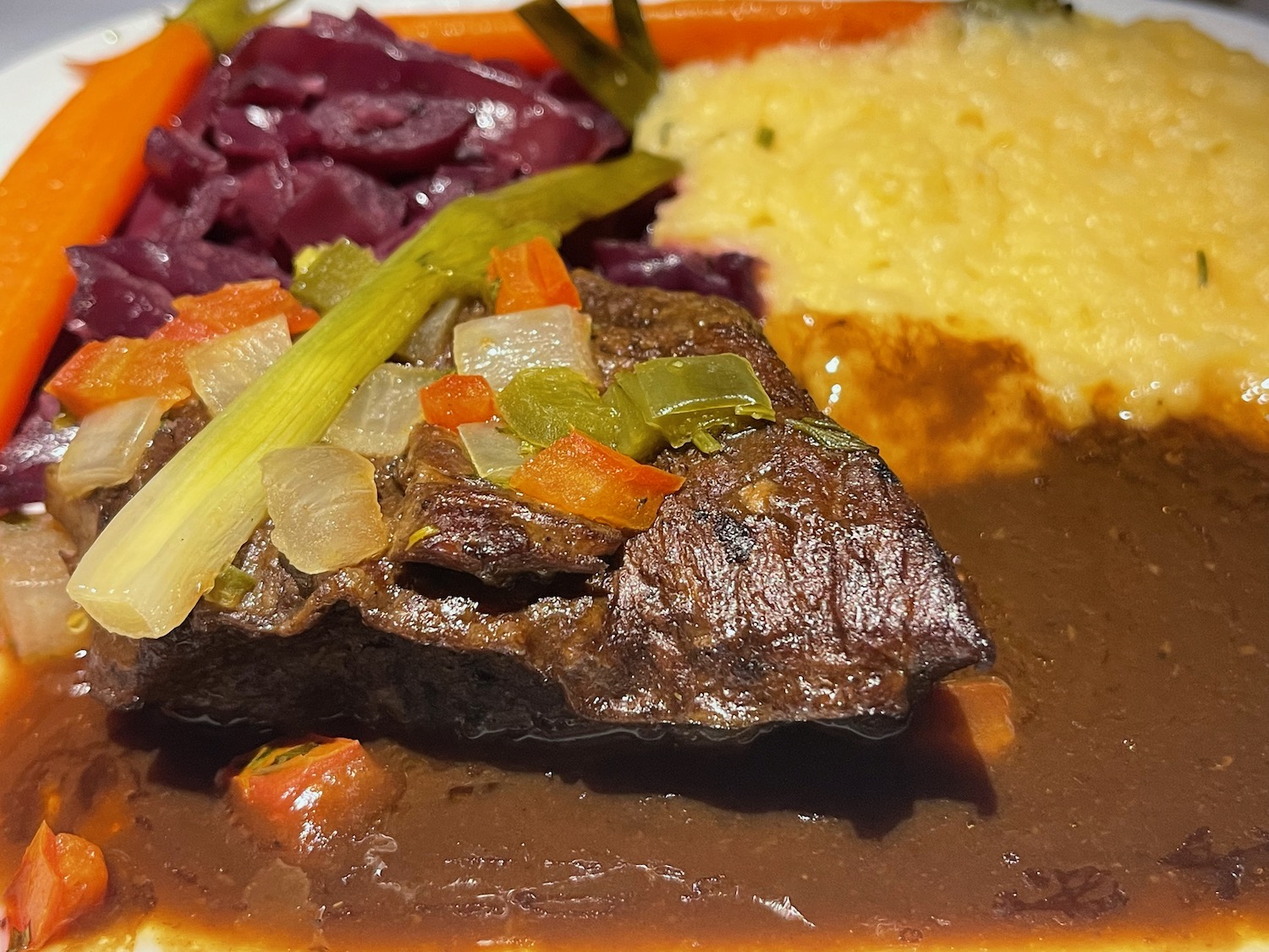 a plate of food with meat and vegetables