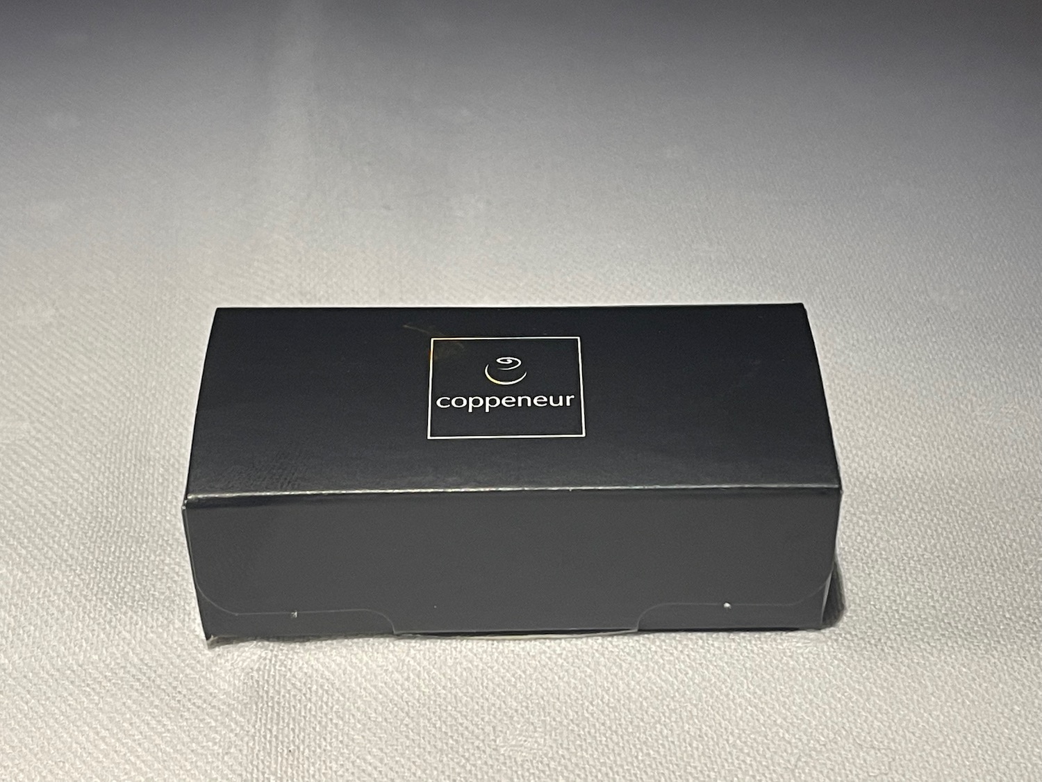 a black box with a logo on it