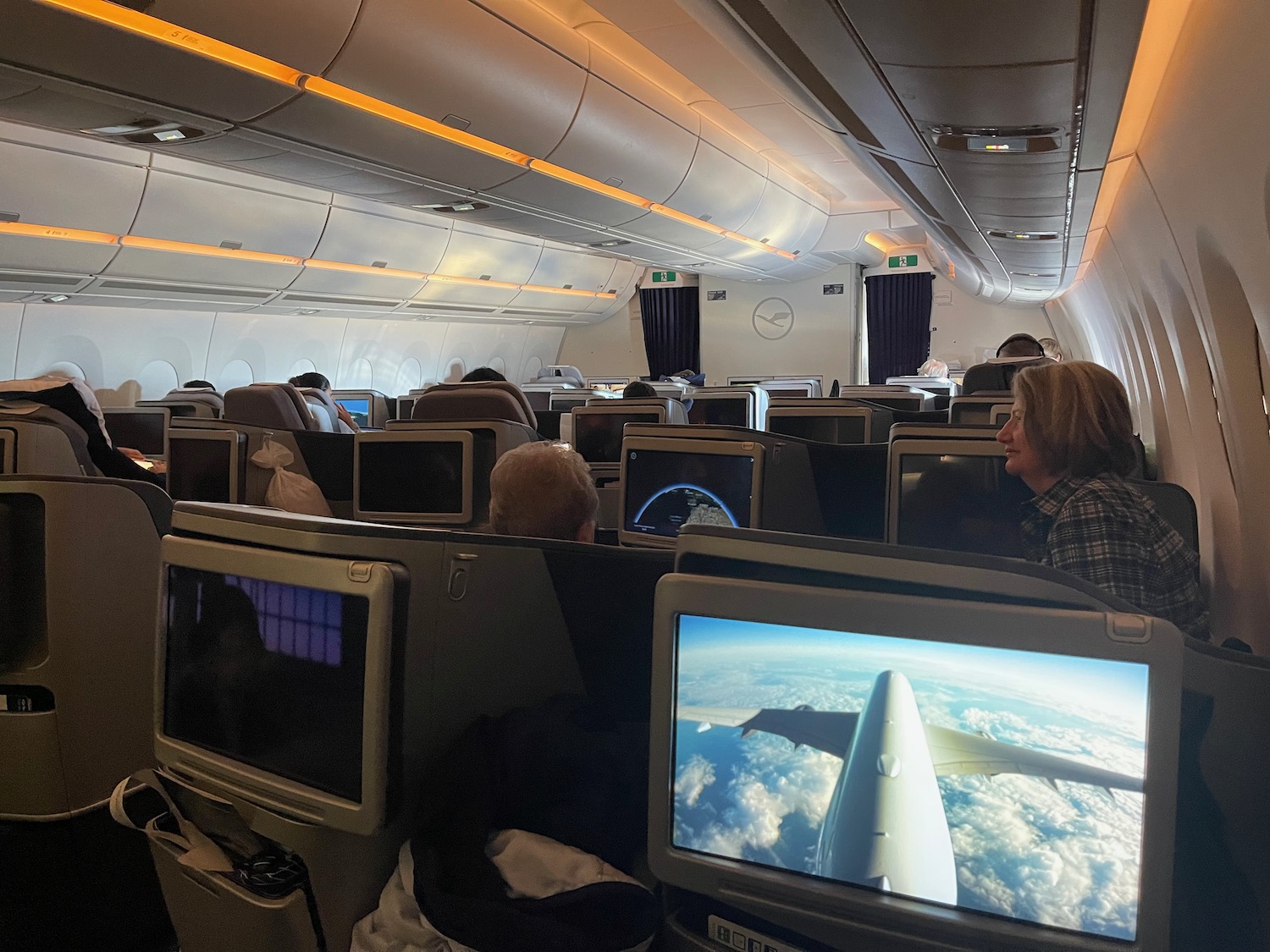 a group of people sitting in an airplane