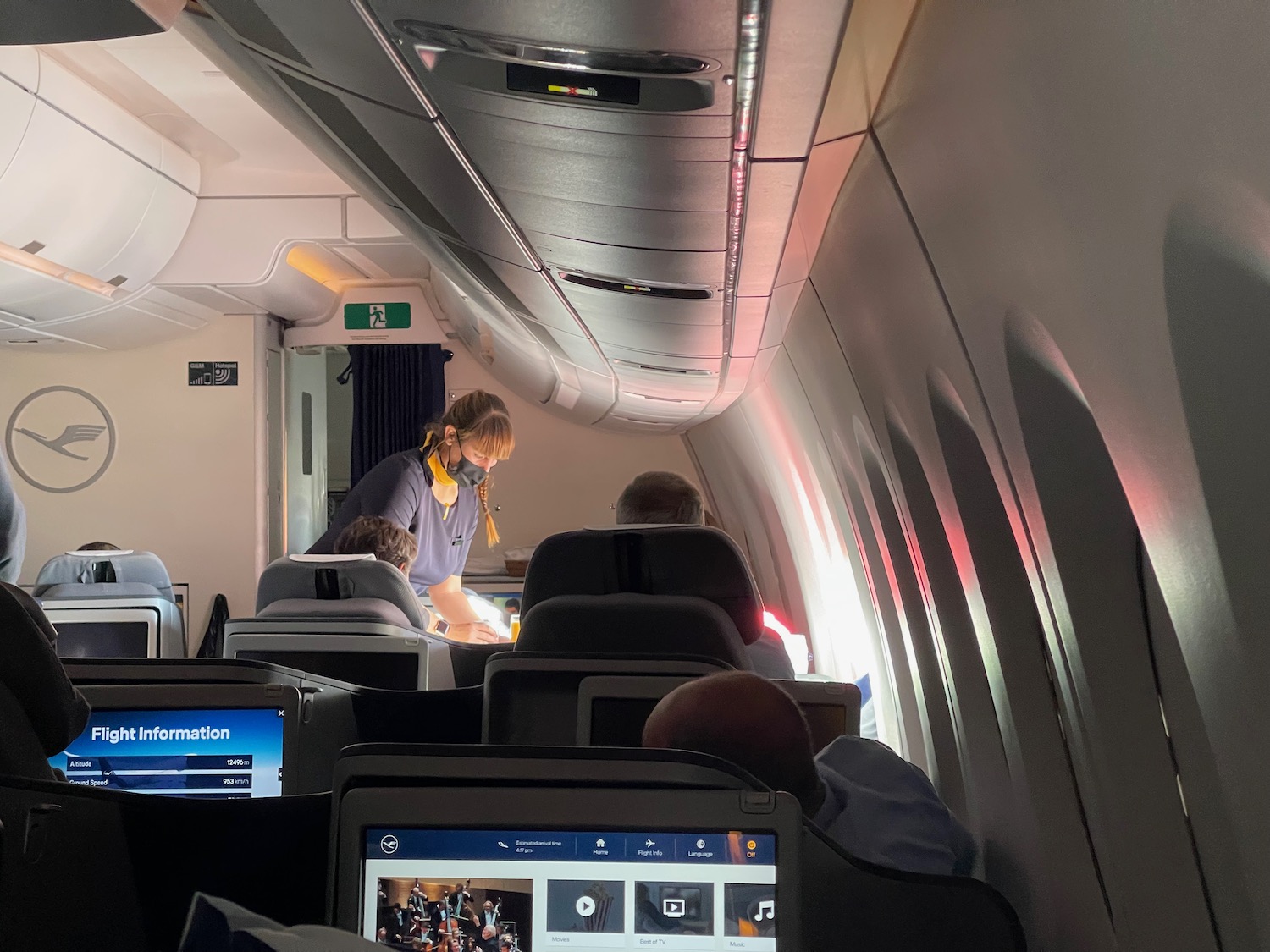 a group of people sitting in an airplane