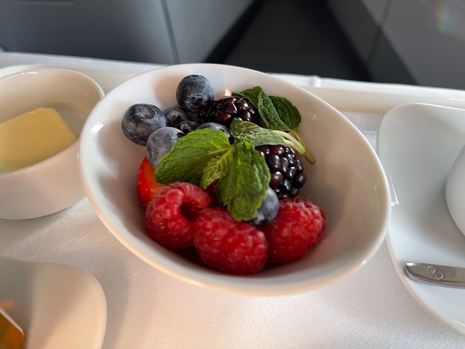 a bowl of fruit on a table