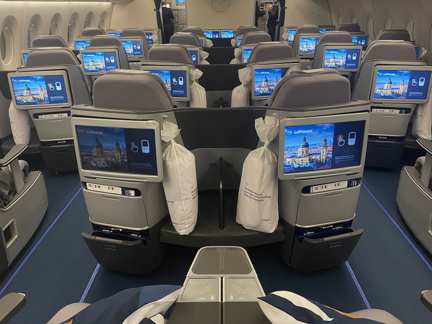 a row of seats with monitors