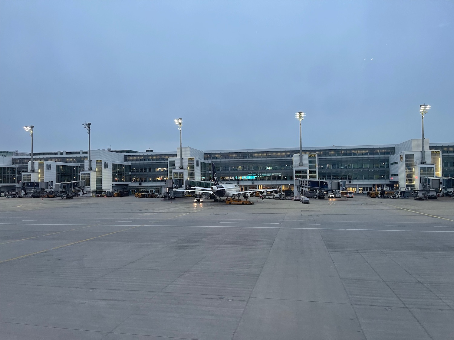 a large airport with airplanes parked in front of it