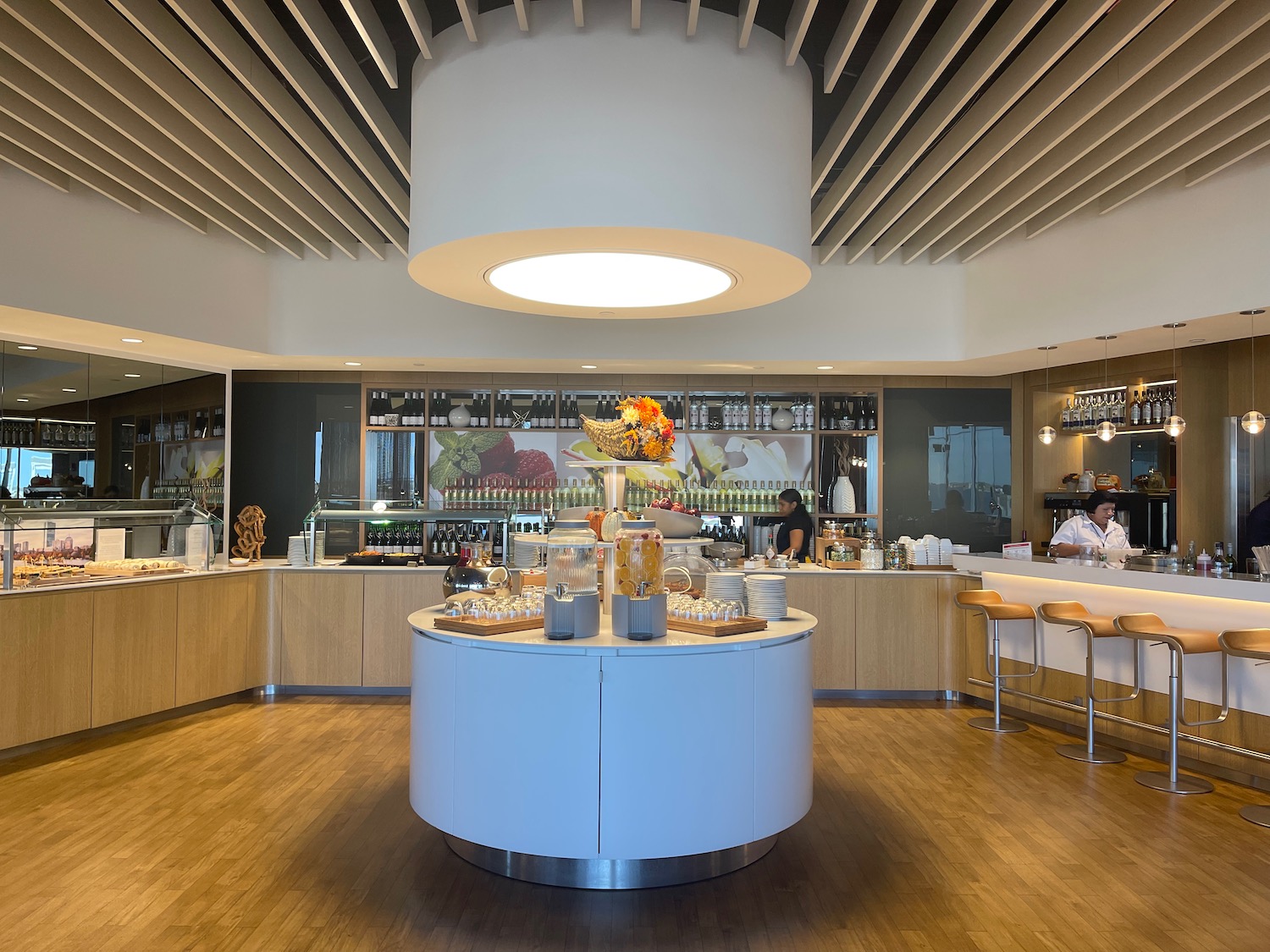 a room with a large round table with food on it