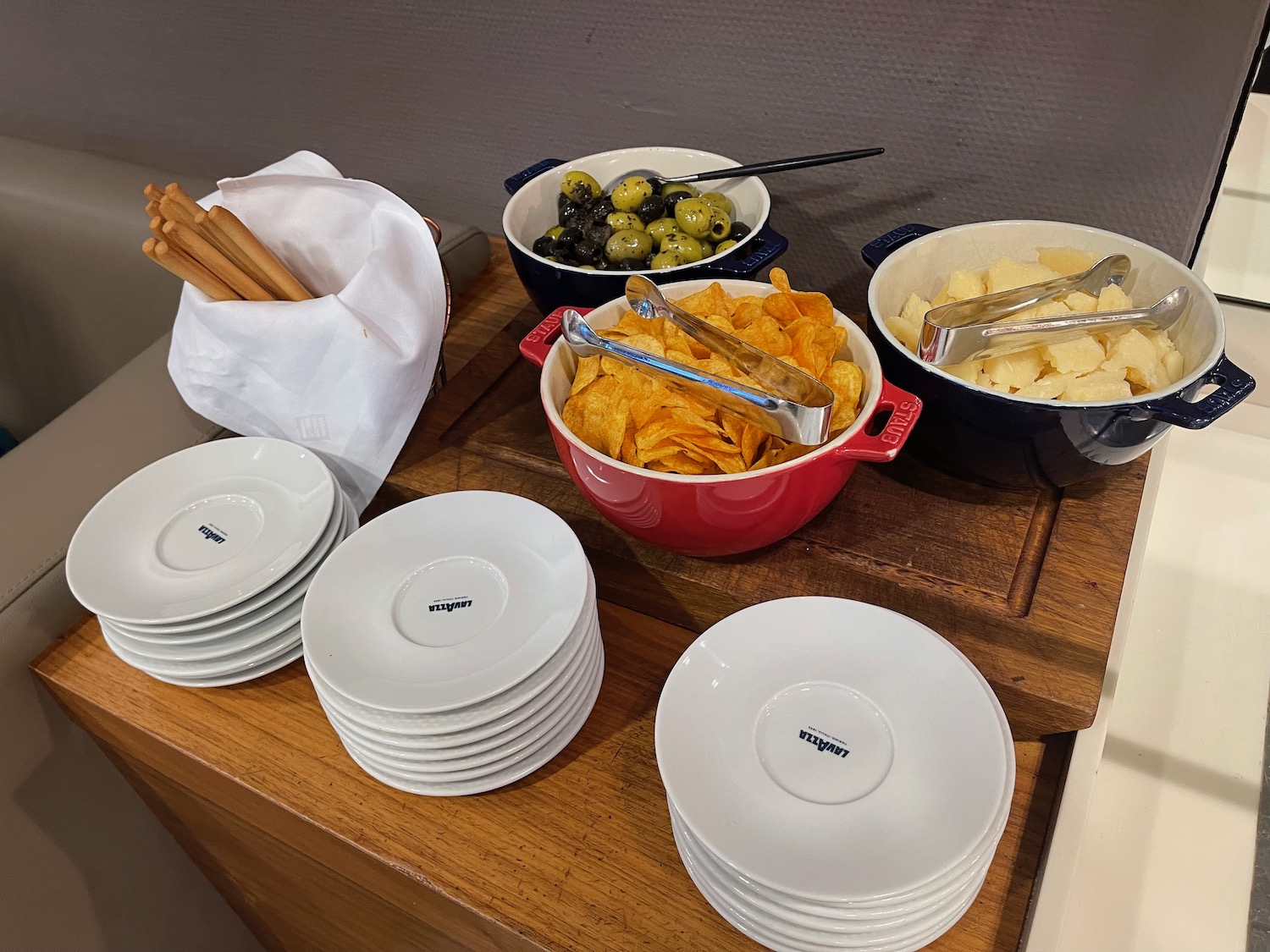 a table with plates and bowls of food