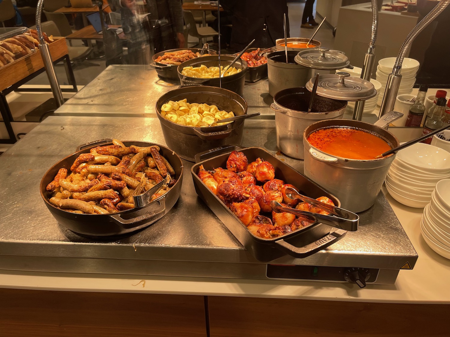 a group of pans of food on a table