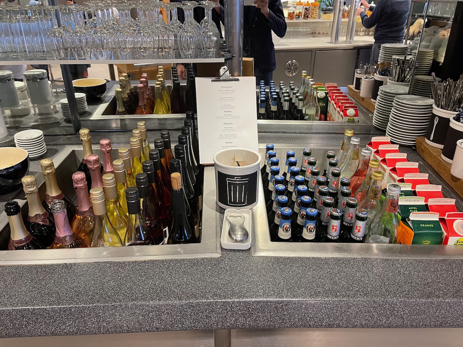 a counter with bottles and glasses