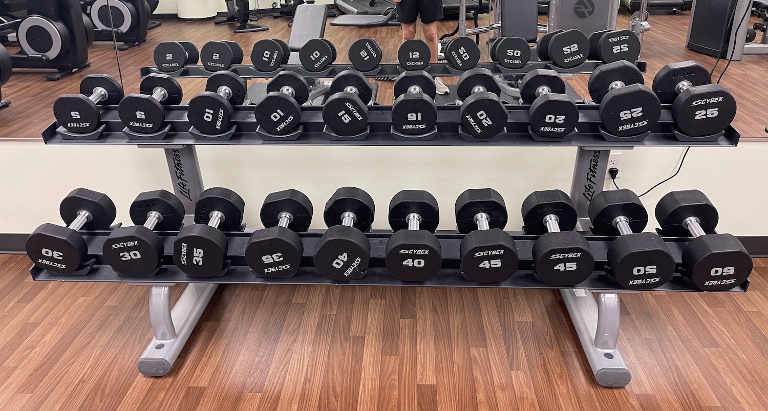 a rack of weights in a gym