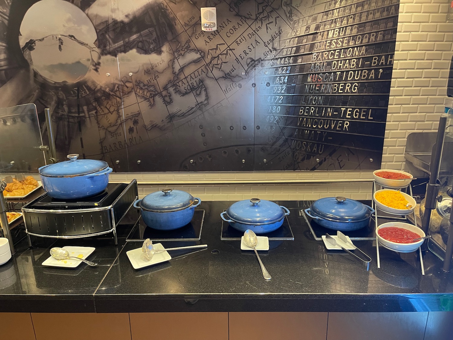 a group of blue pots on a counter