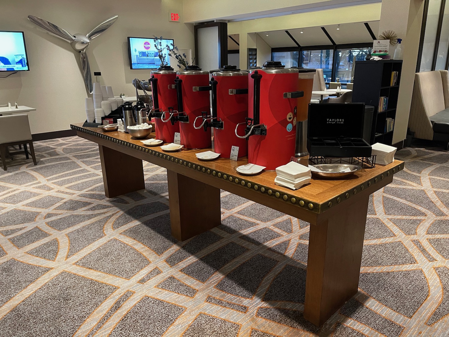 a large table with red containers on it