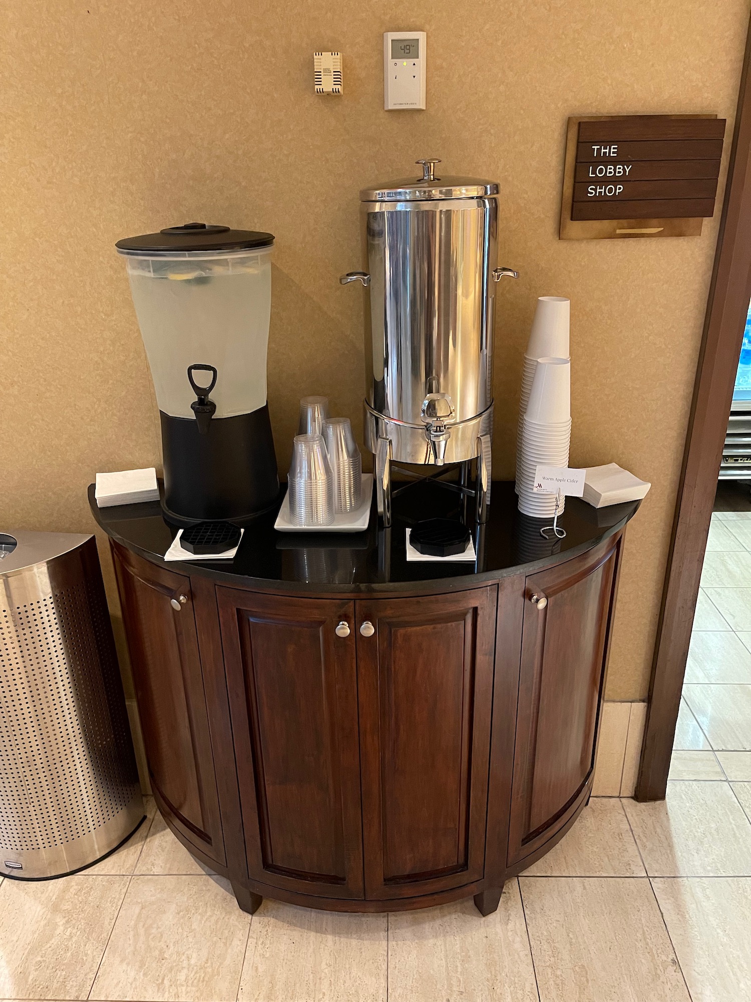 a coffee maker and cups on a table