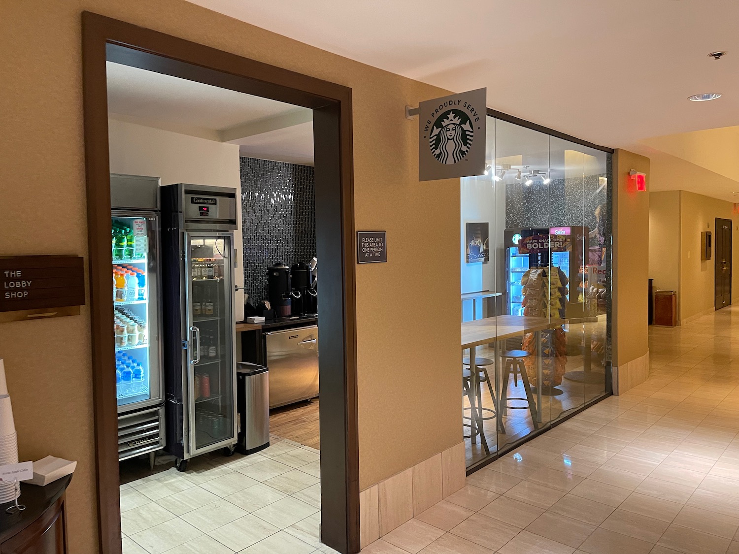 a coffee shop with a glass door