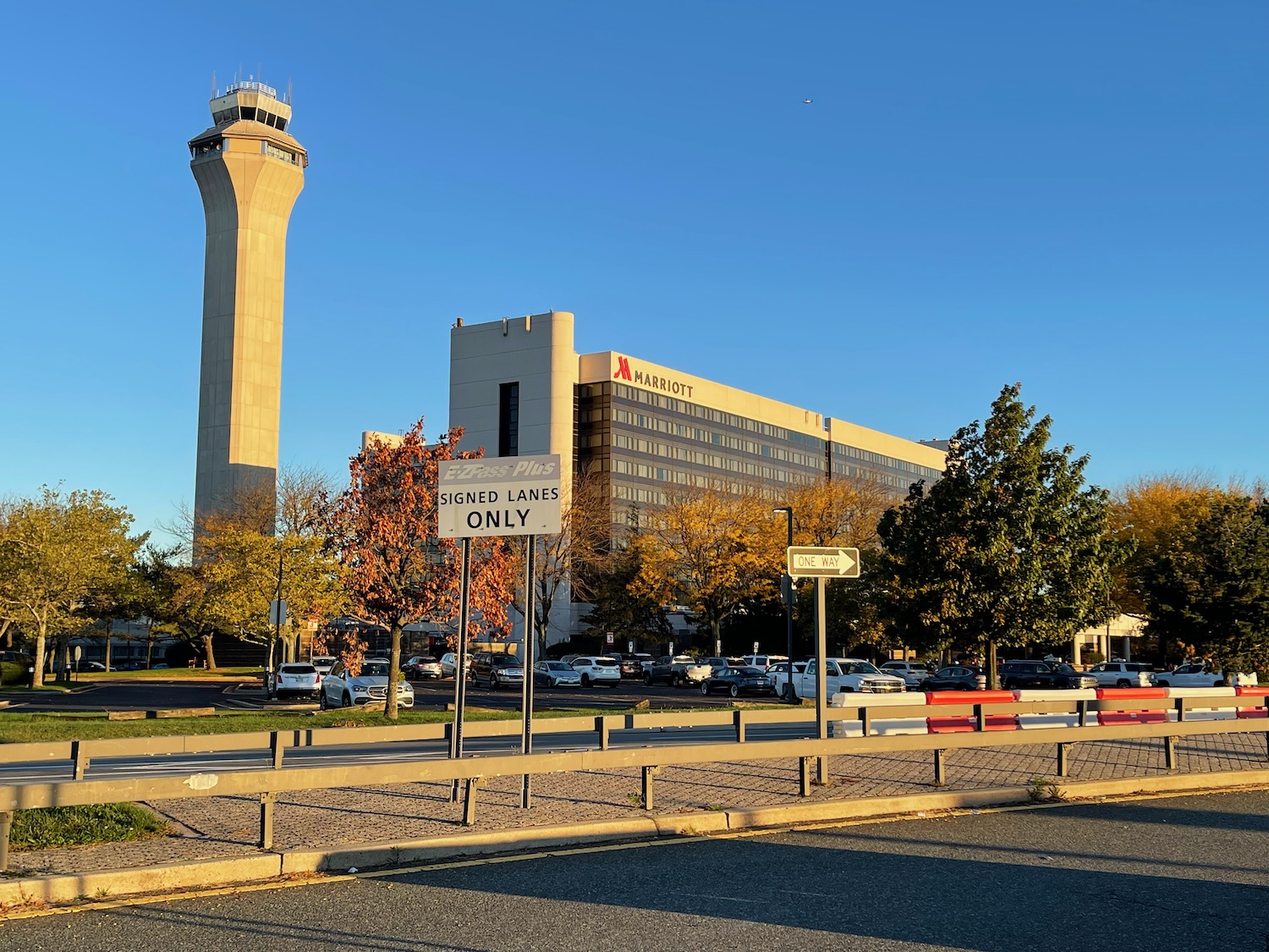 a road with a tower and a building