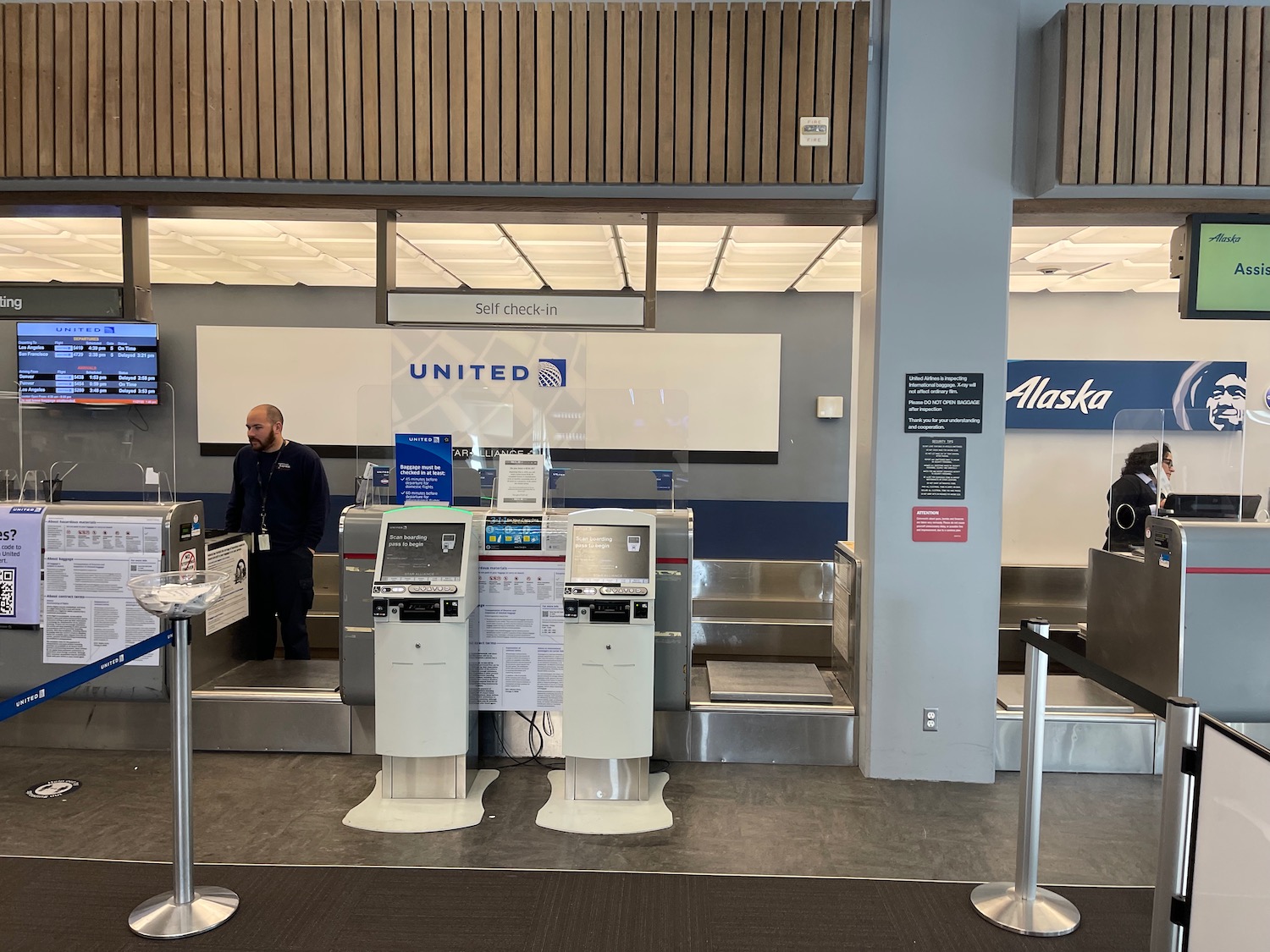 a man standing in front of a check in counter