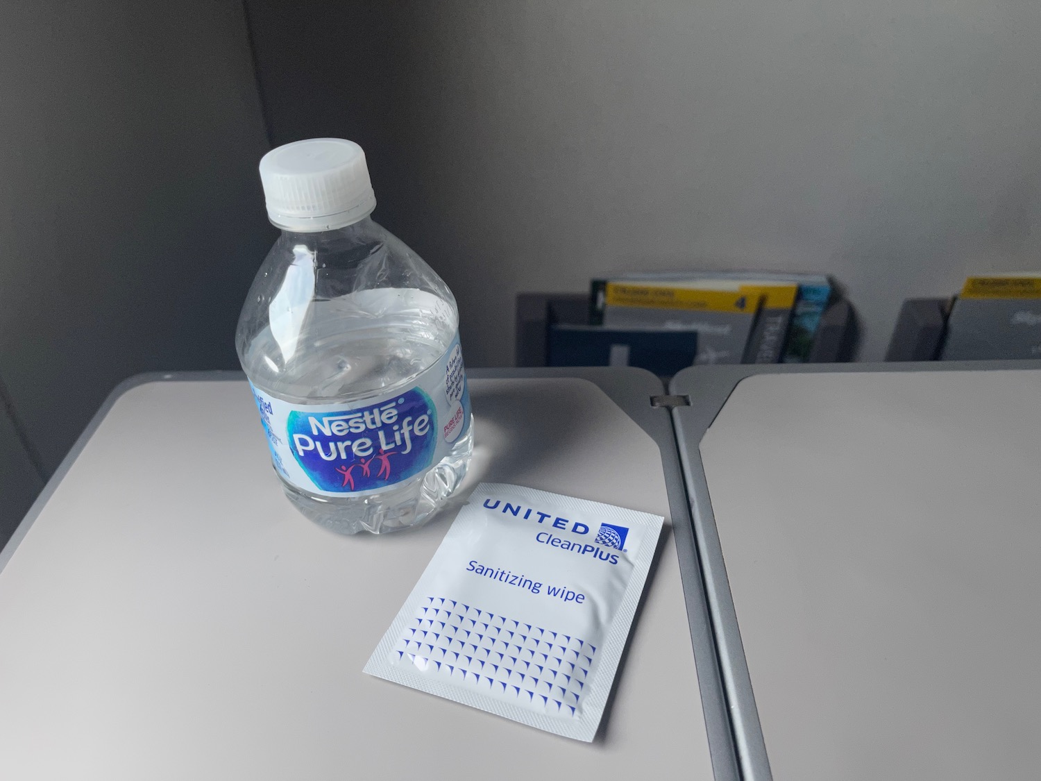 a bottle of water and a packet of sanitizer