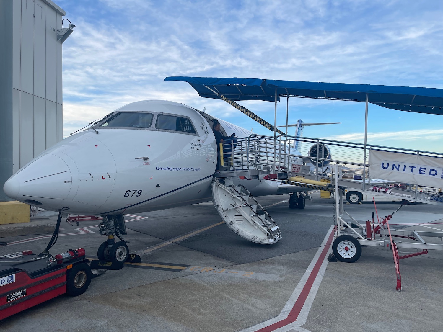 a plane with stairs and ladder on the side