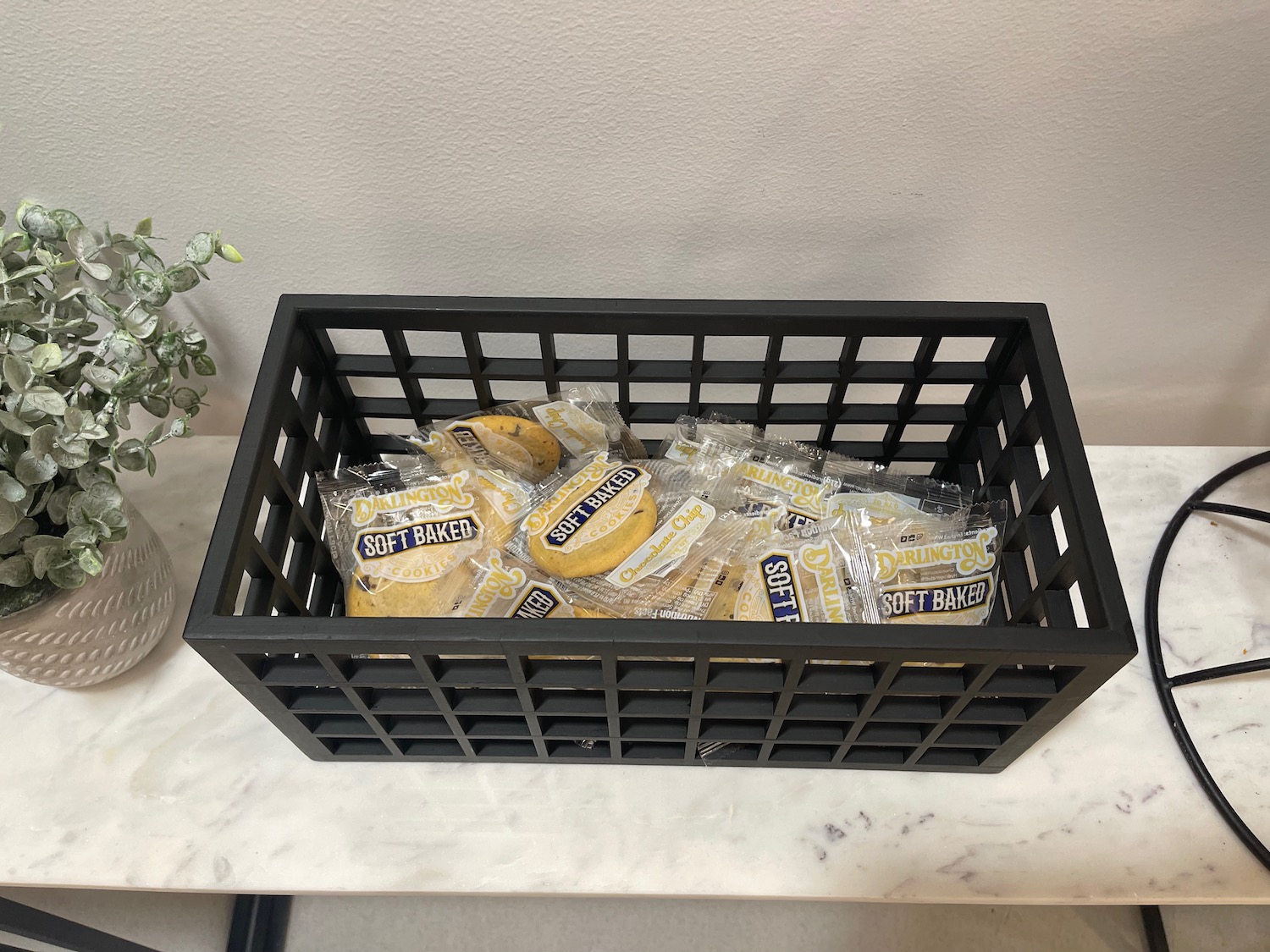 a black basket with food in it