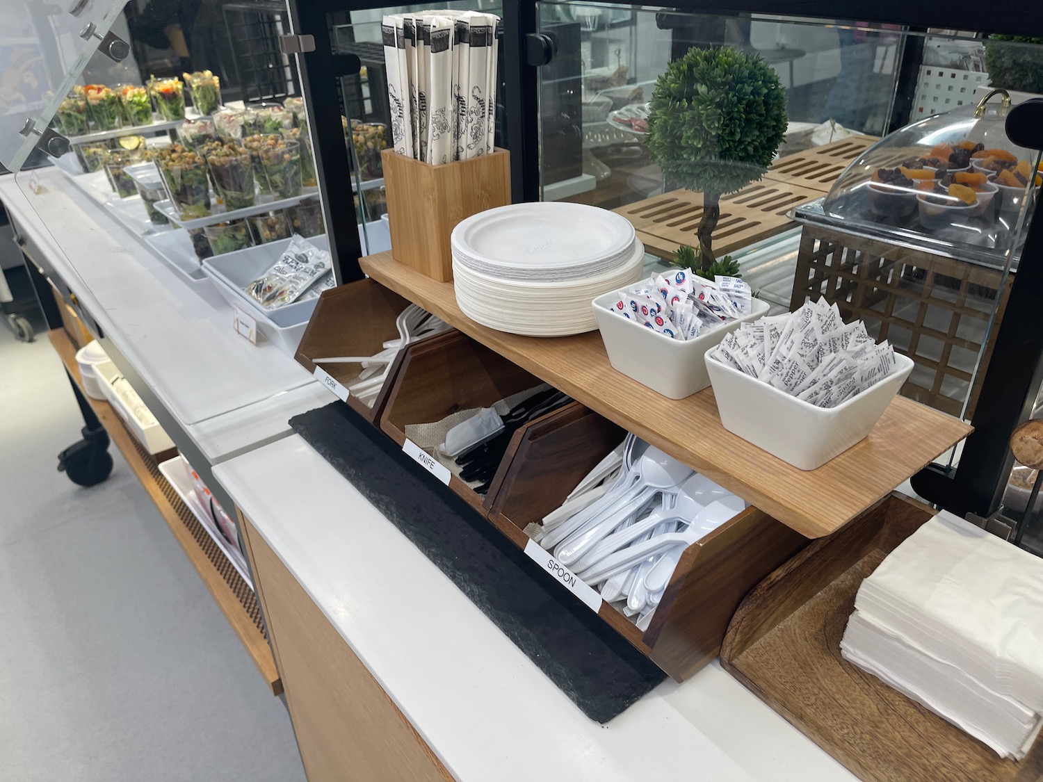 a shelf with utensils and plates