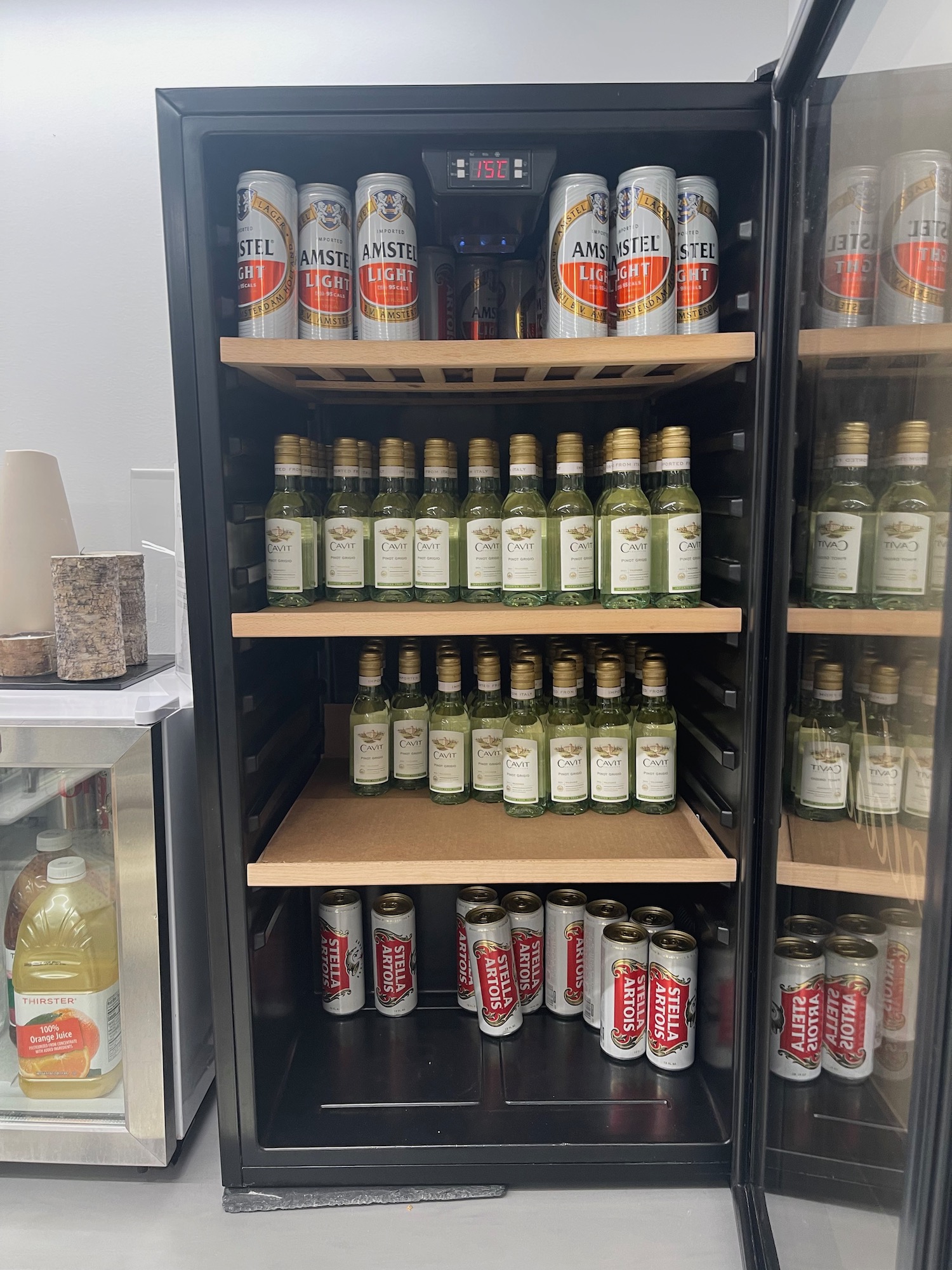 a refrigerator full of beer and cans