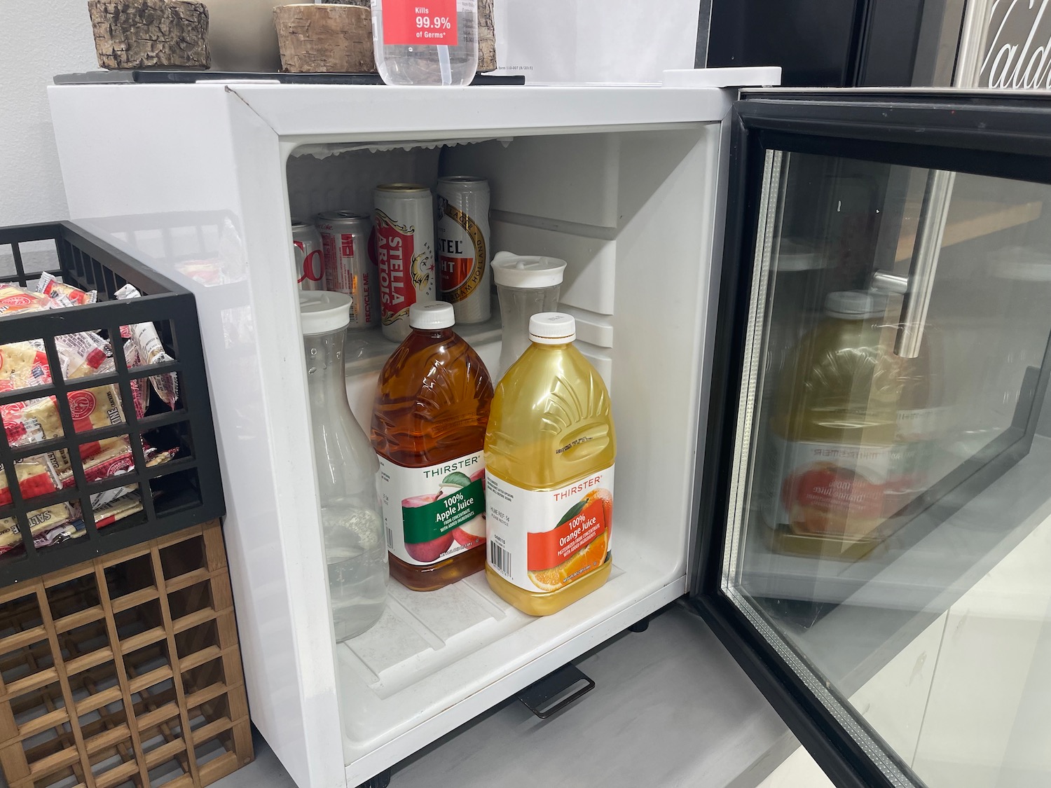 a small refrigerator with a door open