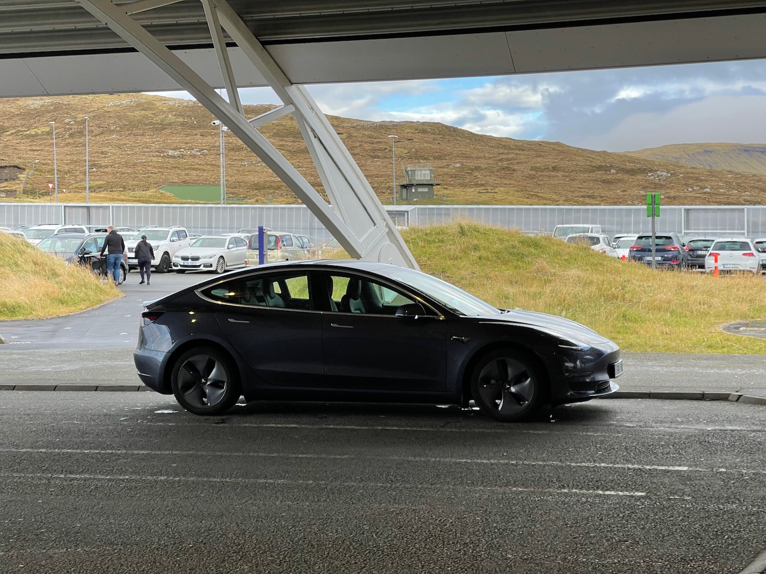 a car parked under a bridge