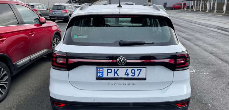 a white car parked in a parking lot