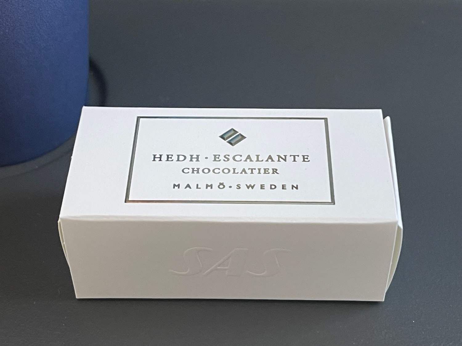 a white box with silver text on it