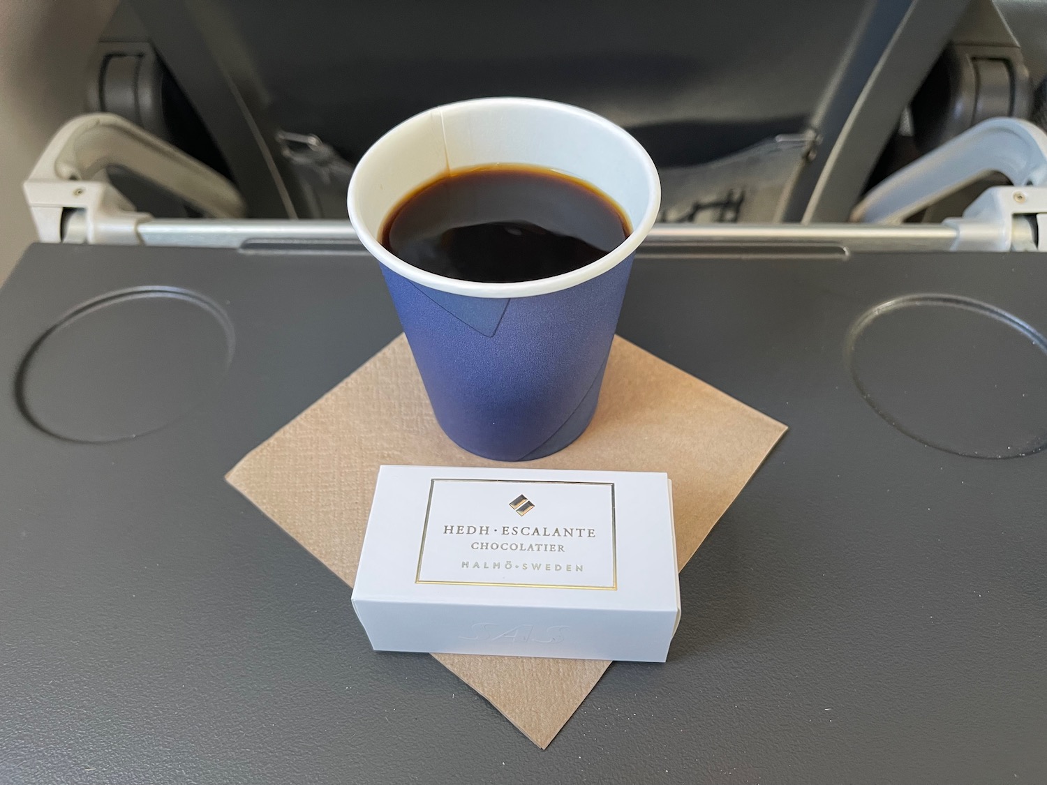 a cup of coffee and a box on a table