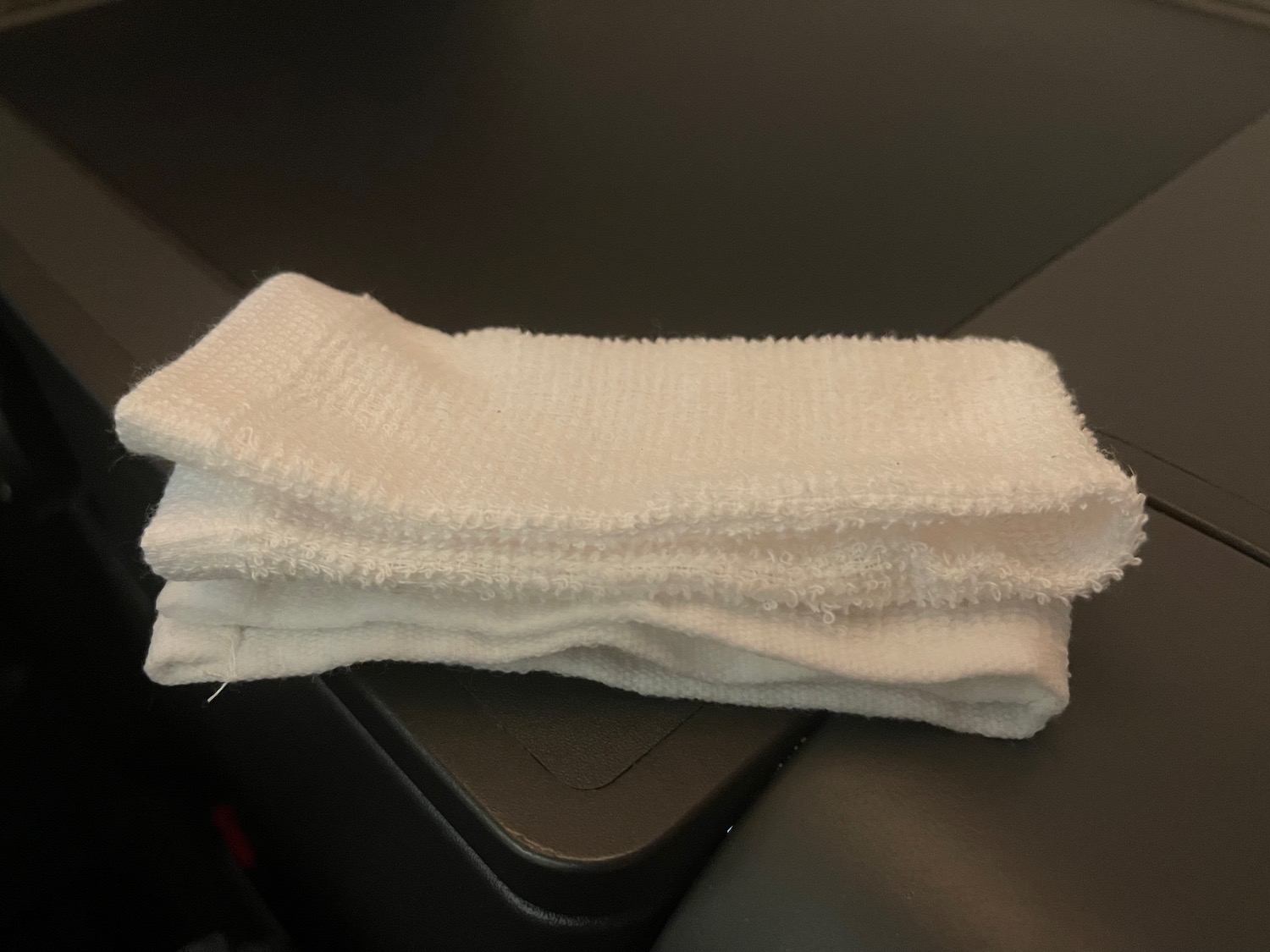 a white towel on a black surface