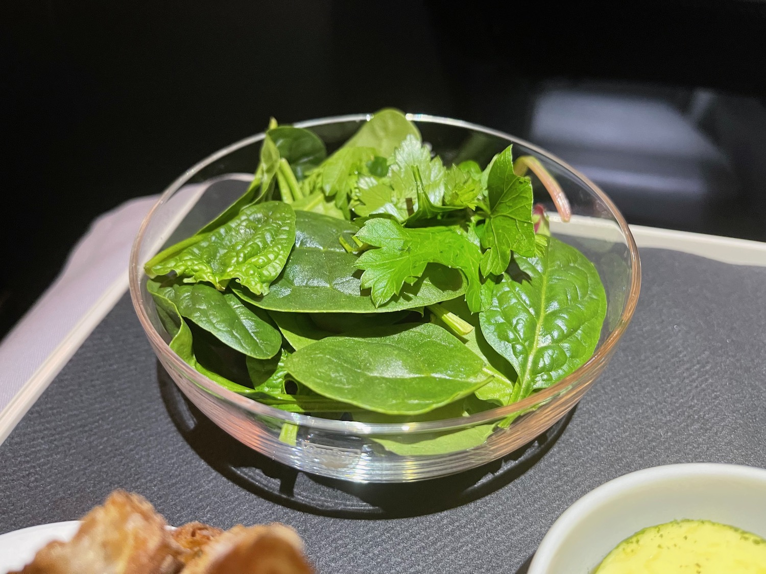 a bowl of spinach and parsley