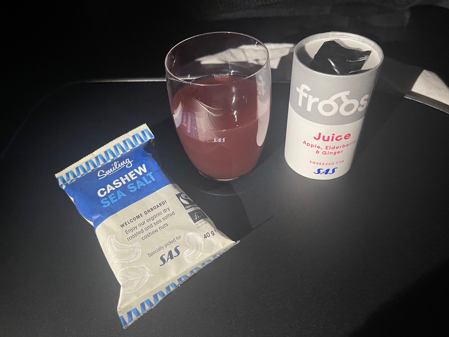 a glass of juice and a packet of juice
