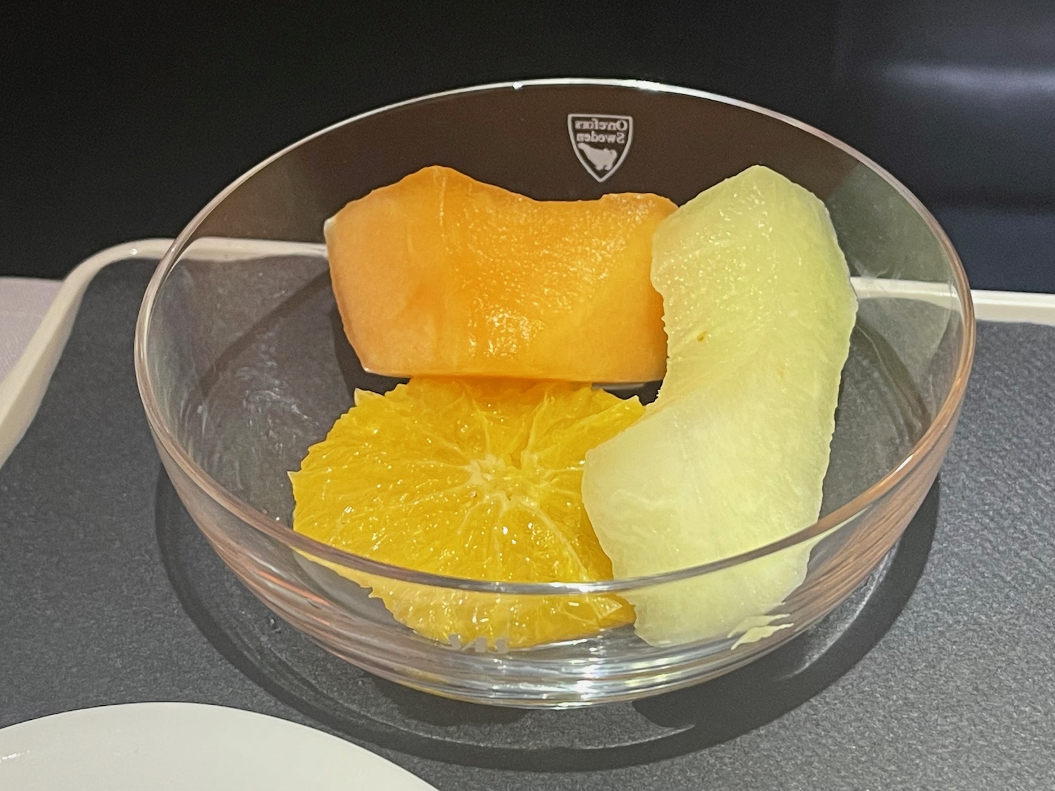 a bowl of fruit on a table