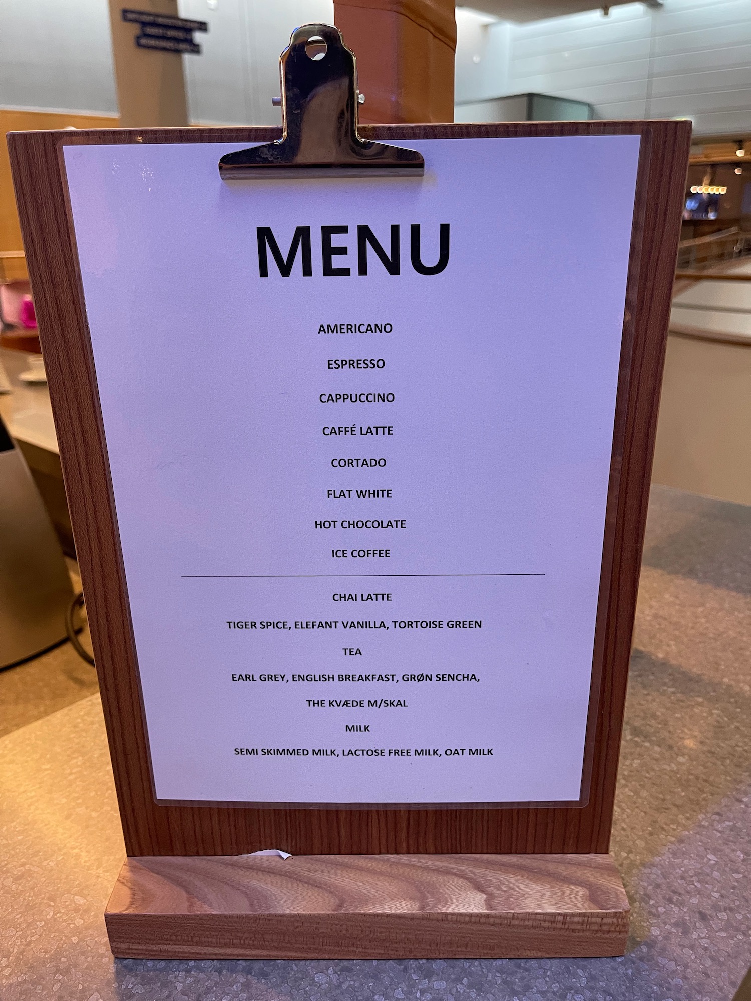 a menu on a wood clipboard