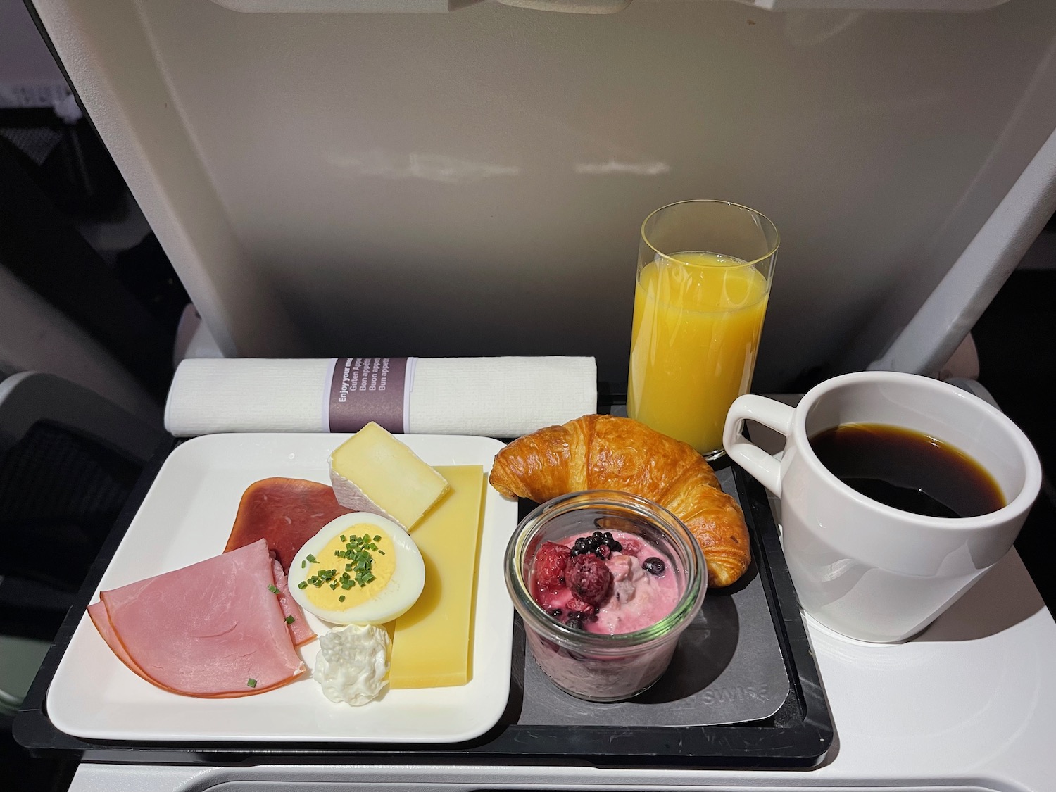 a tray of food and a drink on a tray