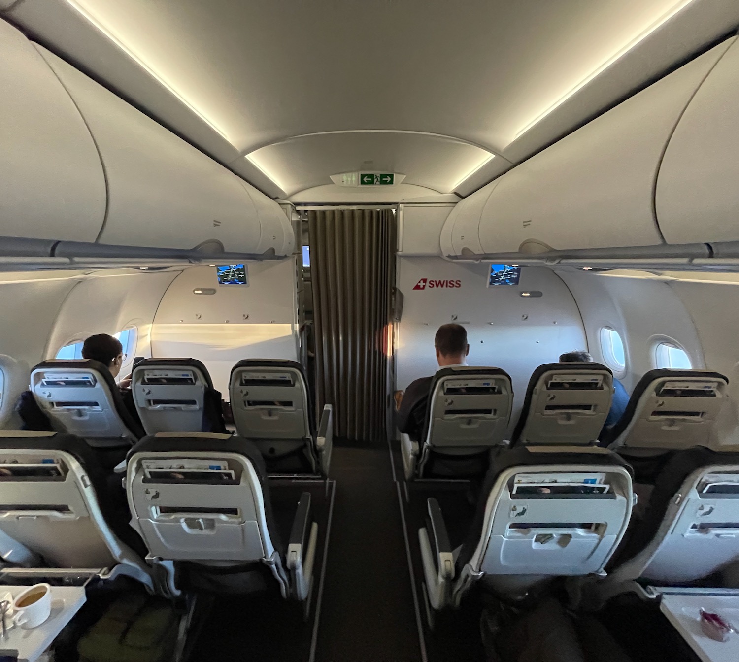 a group of people sitting in an airplane