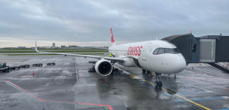 a white airplane on a runway