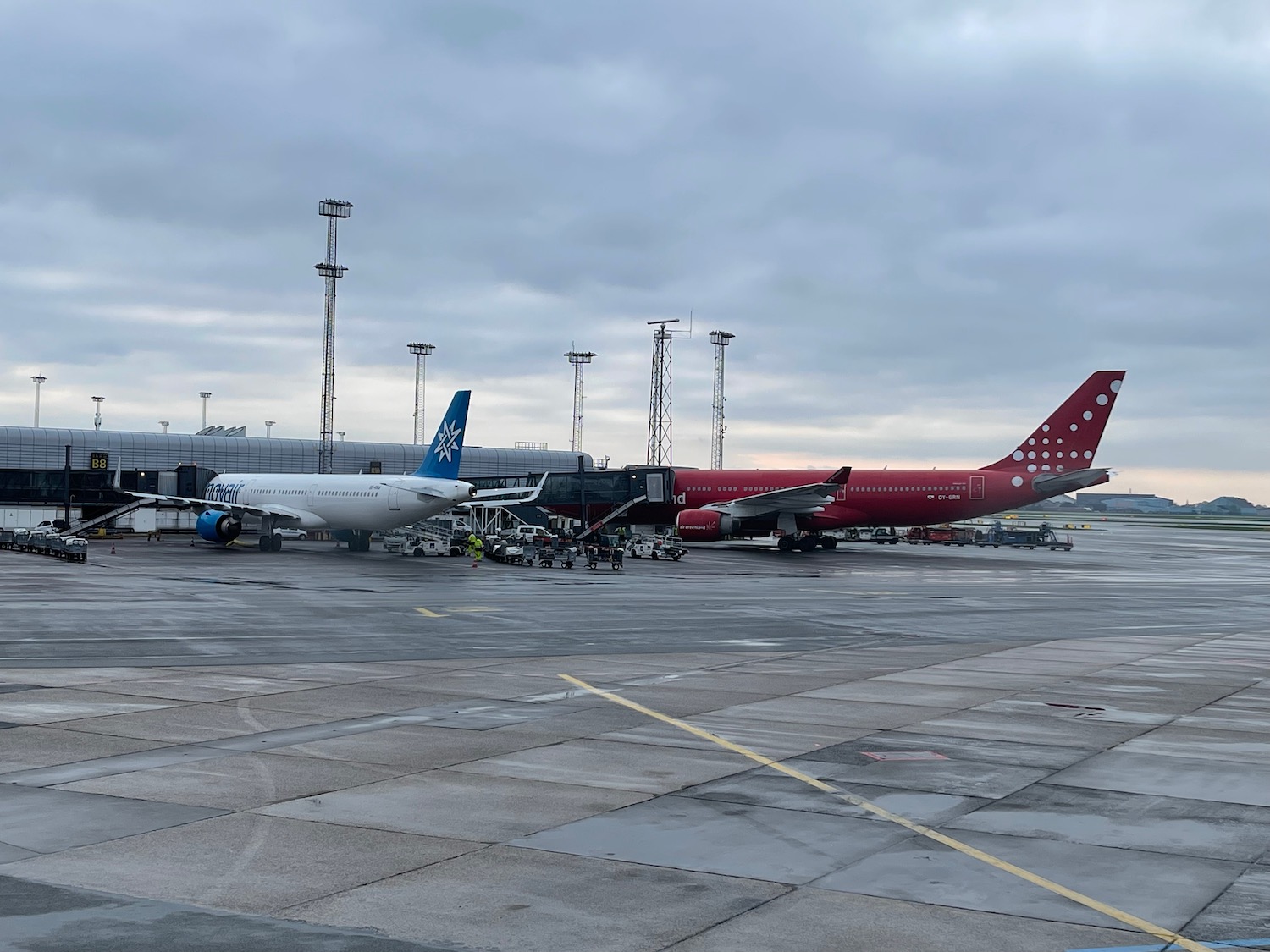 a group of airplanes parked on a tarmac