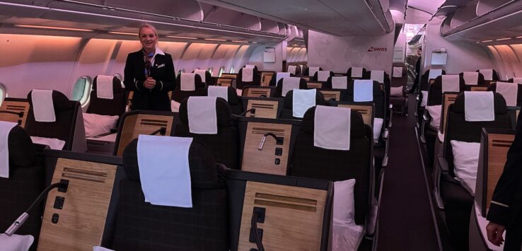 a woman standing in an airplane