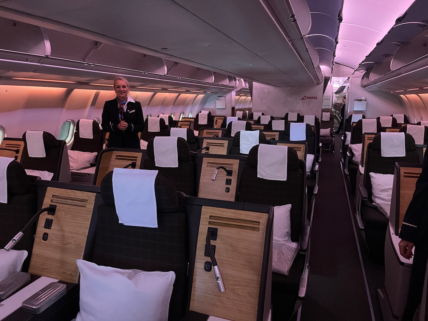 a woman standing in an airplane