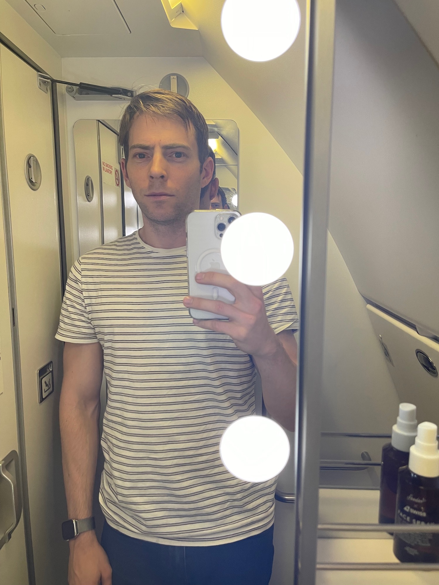 a man taking a selfie in a mirror