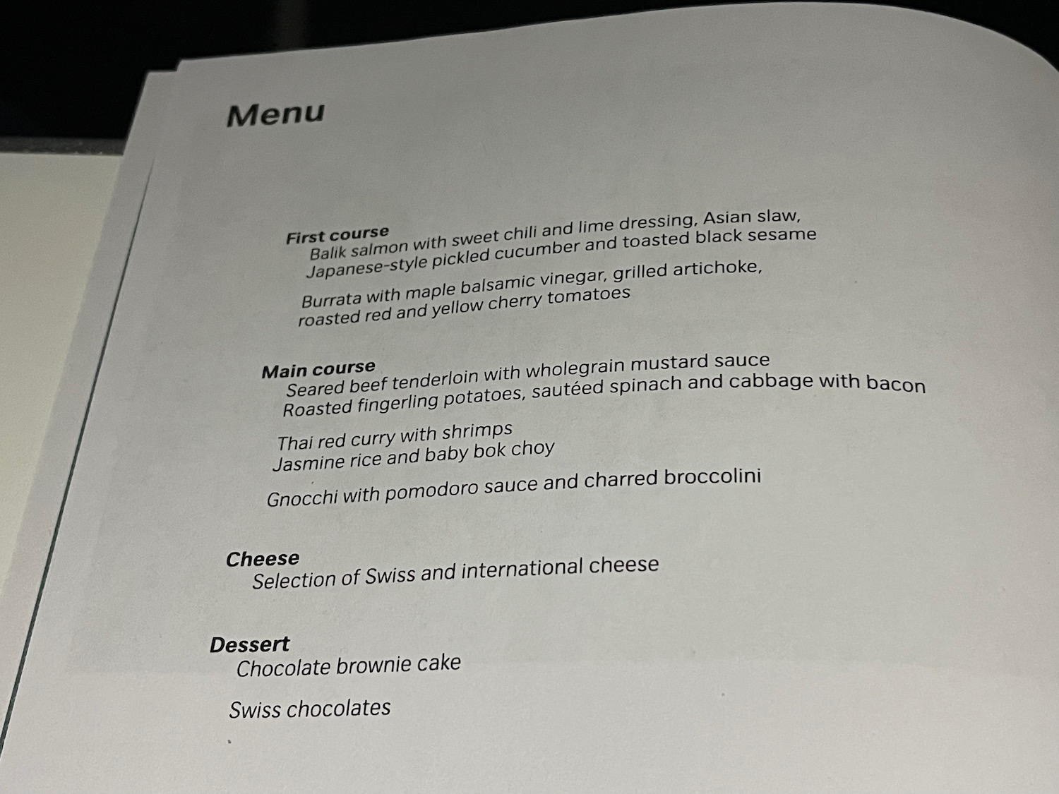 a menu on a black surface